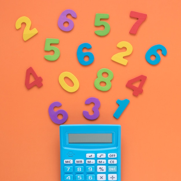 Free photo colourful math numbers with calculator close-up