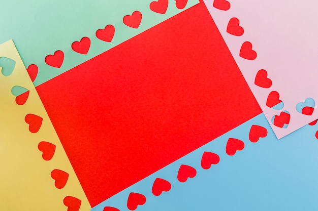 Free photo colourful papers with symbols of heart