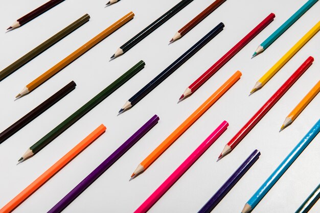 Colourful pencils on white background