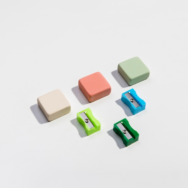 Free Photo colourful sharpeners and erasers high view