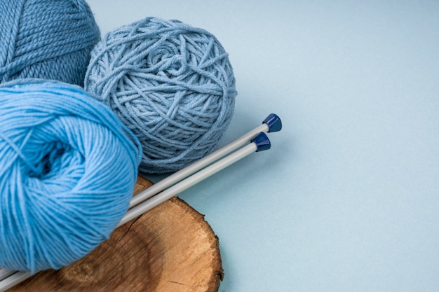 Free photo colourful wool yarn with crocheting needles