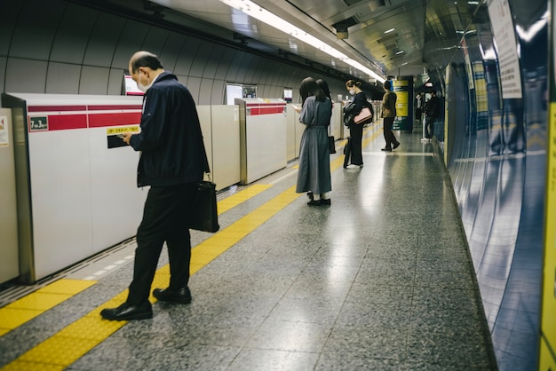 Commuters waiting for the subway train at the station