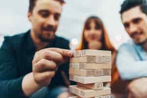 Free photo the company of young people playing board game