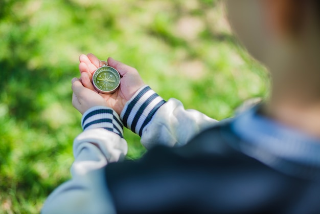 Free Photo compass on the hands of a child