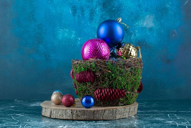 Composition of christmas baubles on blue.