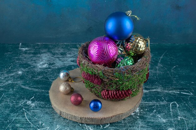 Composition of christmas baubles on blue.