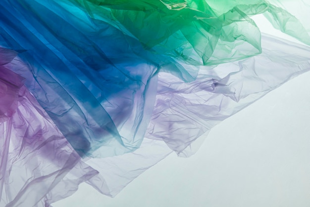 Free photo composition of different colored plastic bags