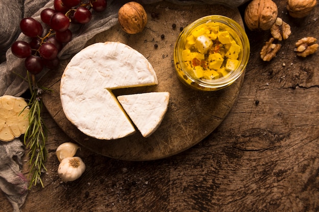 Free photo composition of different delicacies on wooden table