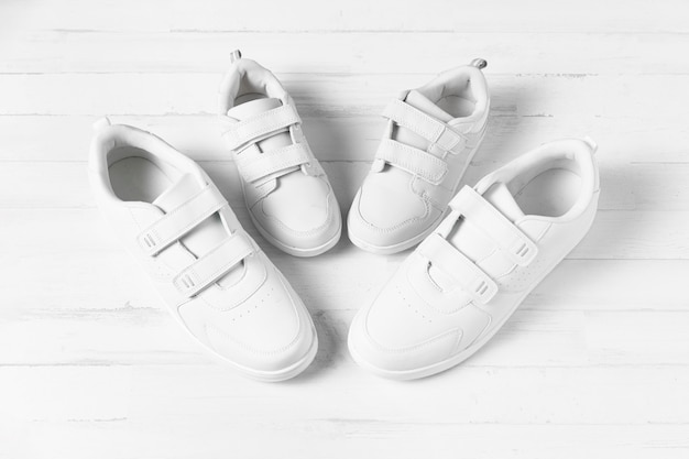 Free photo composition of father and son shoes