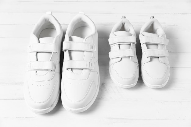 Free photo composition of father and son shoes