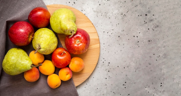 Composition of fresh autumnal fruits with copy space