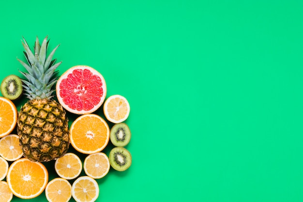 Composition of mixed cut of colorful tropical fruits