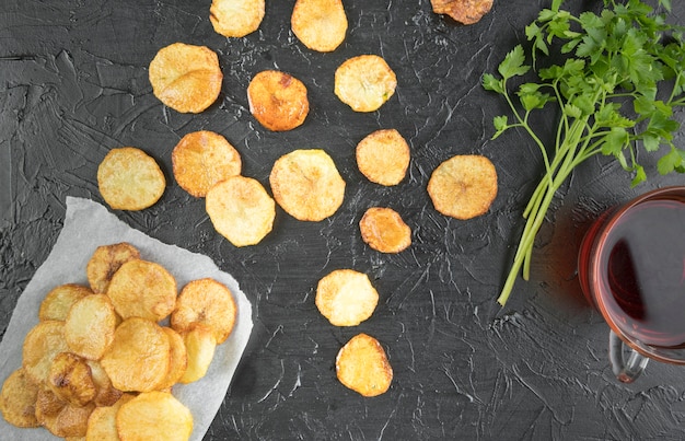 Free Photo composition of potato chips on black table