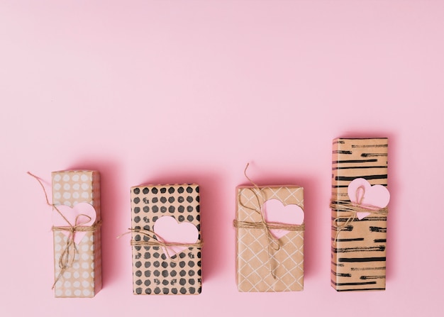 Free photo composition of present boxes with decorative paper hearts