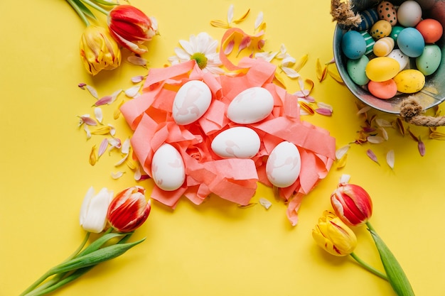 Free photo composition of tender flowers and easter eggs