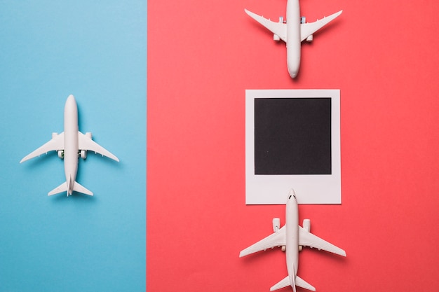 Composition of toy airplanes and instant frame