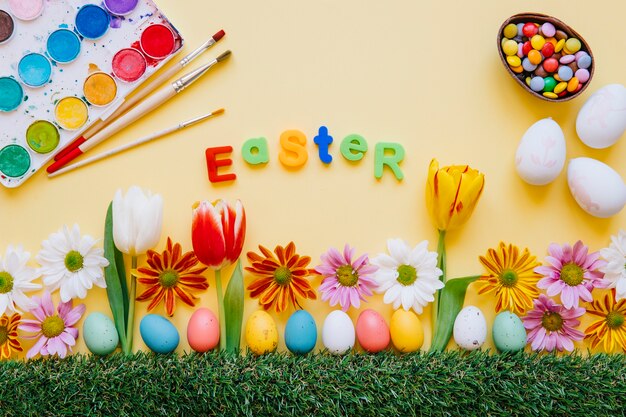 Composition of various Easter eggs and flowers