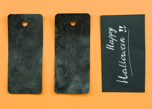 Free Photo composition with black cards and happy halloween inscription