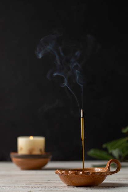 Free photo composition with candles on wooden table