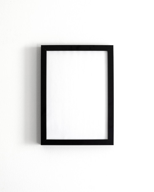 Free Photo composition with empty frame on wall