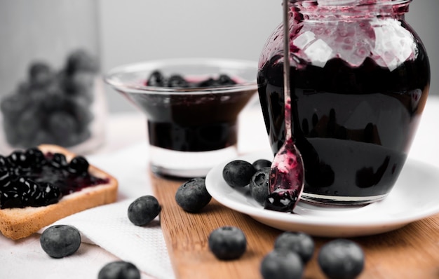 Composition with jar of blueberry jam