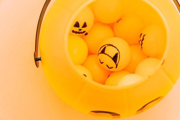 Free photo composition with orange balls with scary faces