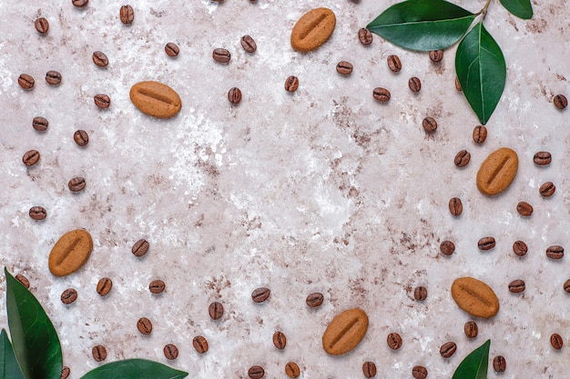 Composition with roasted coffee beans and coffe bean shaped cookies