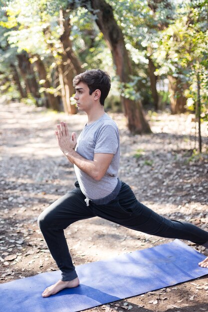 Concentrated boy stretching muscles