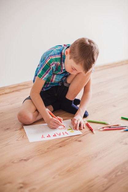 Concentrated child drawing for mother's day