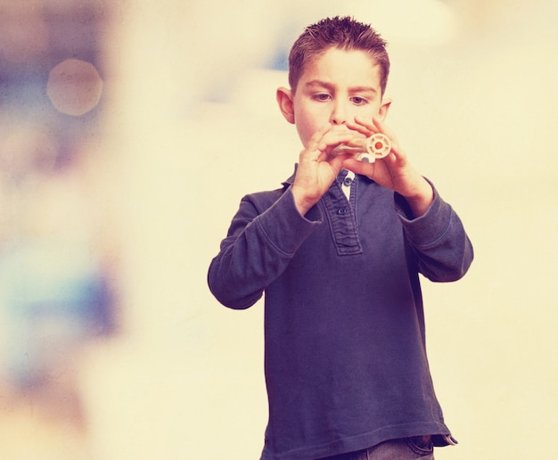 Concentrated child playing the flute