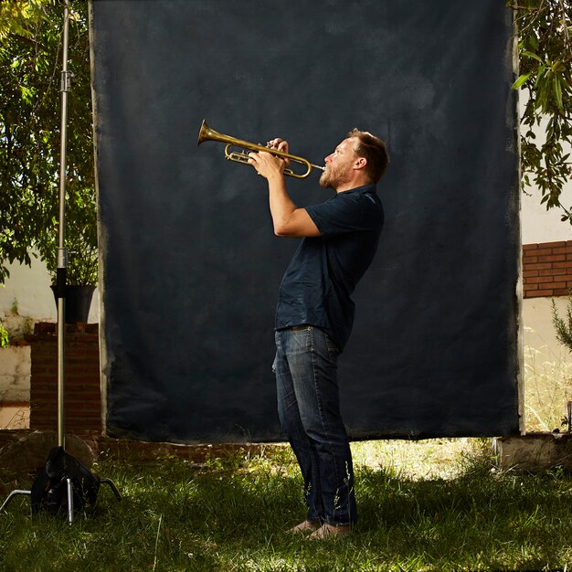 concentrated musician playing his instrument