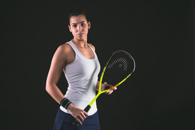 Concentrated squash player posing