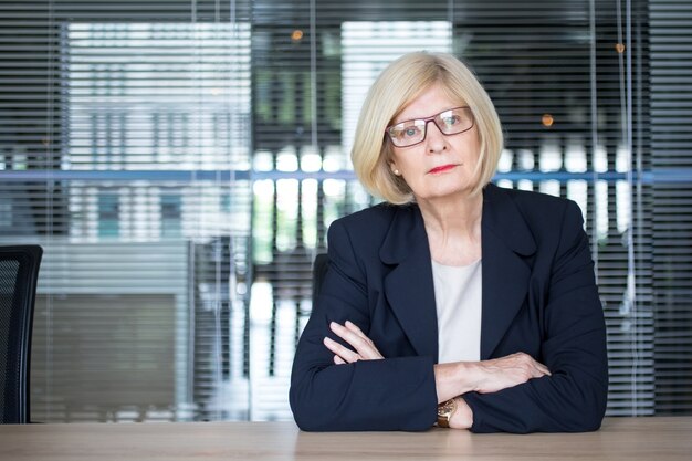 Concentrated woman participating in conference