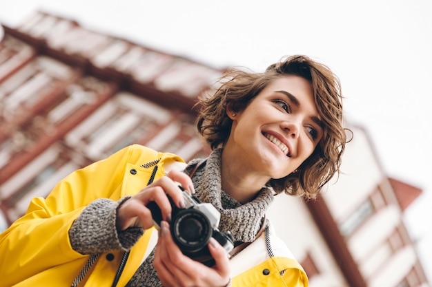 Concentrated young lady photographer