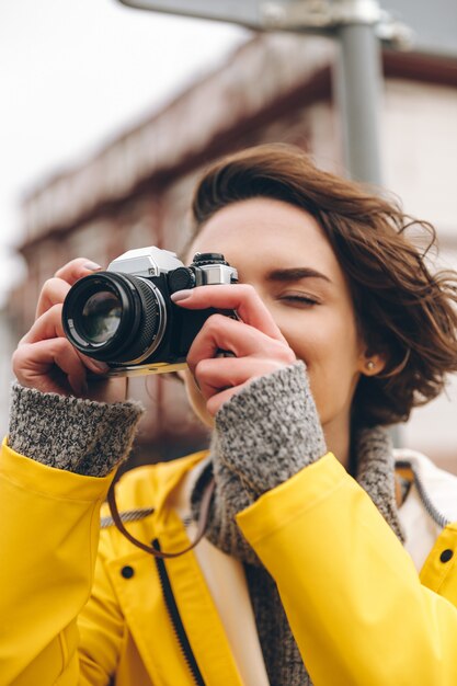 Concentrated young lady photographer