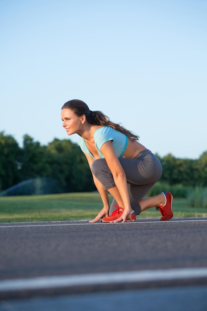 Concept of health body care sport strength lightness Selflove morning run lightness in the body of a young woman who warms up before running