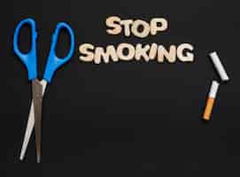 Free photo concept of stop smoking above black background