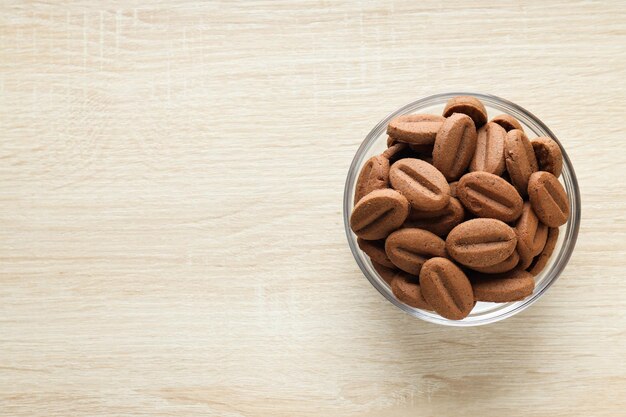 Concept of tasty snack for hot drink cookies in the shape of coffee seeds