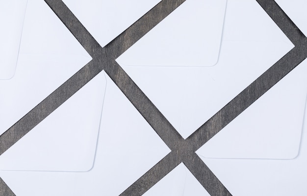 Conceptual of mail with white envelopes on gray background top view. horizontal image