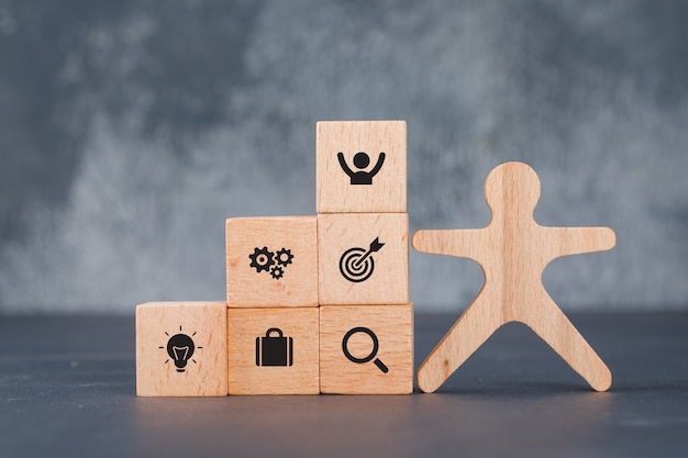 Free Photo conceptual of success and target. with wooden human and blocks.