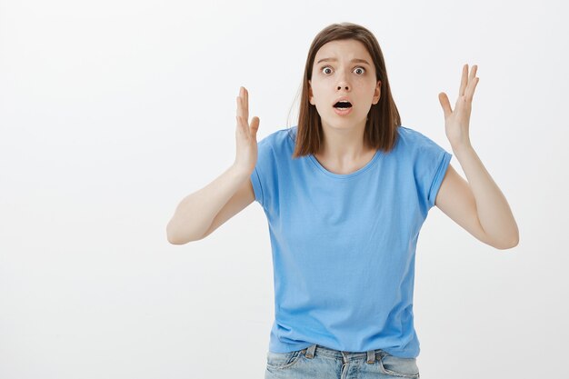 Free Photo concerned and anxious woman gasping react to something terrible, bad situation