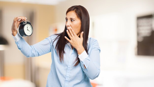 Concerned woman covering her mouth