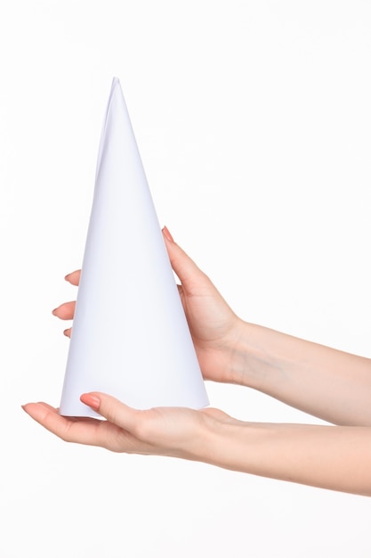 Free photo the cone in female hands on white space