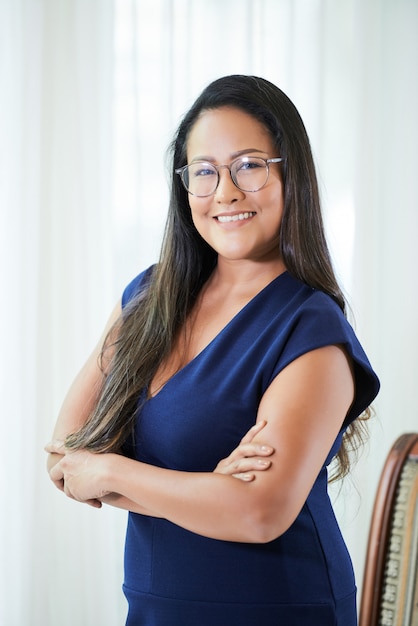 Confident adult businesswoman smiling at camera