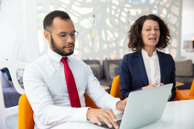 Confident business people talking during meeting