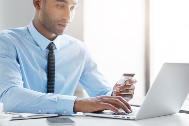 Confident businessman working at the desk