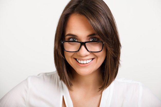 Confident businesswoman in glasses smiling