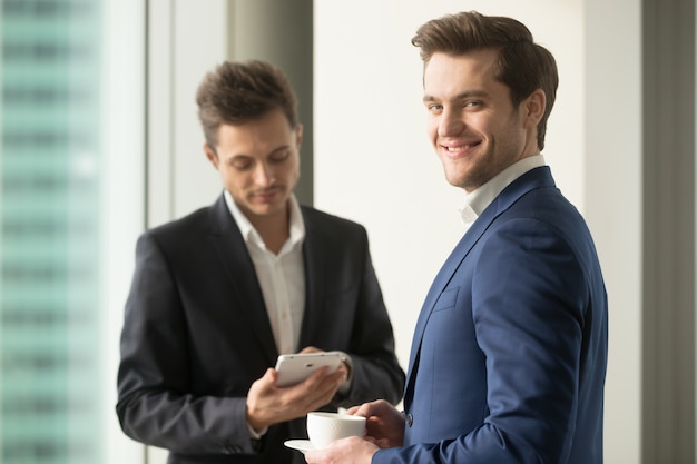 Free photo confident ceo drinking coffee and planning work day