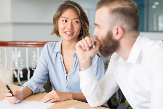 Confident consultant explaining customer document details