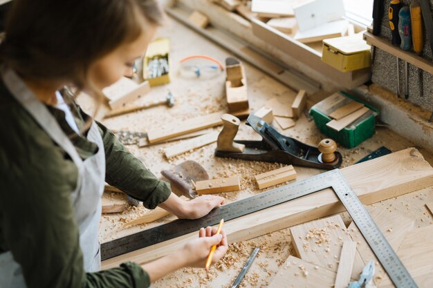 Confident craftswoman wrapped up in work